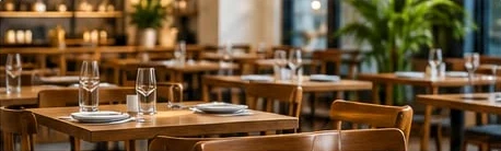 Restaurant interior with dining tables and warm lighting
